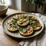 Aubergines fondantes aux anchois et herbes fraîches