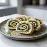 Délicieux roulé d'épinards au saumon fumé : recette facile et rapide