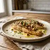 Filets de truite aux noisettes croustillantes et sauce citronnée
