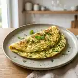 Omelette moelleuse aux courgettes fraîches et menthe parfumée