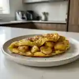 Omelette tropicale flambée aux ananas et bananes : douceur exotique enflammée
